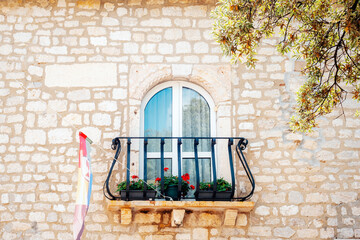 Window and balcony, beautiful old architecture. Rab island, Croatia