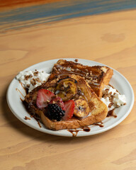 Breakfast set contaion of French toast kiwi and a cup of coffee