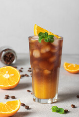 Bumble coffee with ice in tall glass on gray background. Summer trendy refreshing coffee drink promotion