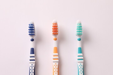 toothbrushes on a white background, close-up, flat lay. Dentistry and healthcare concept