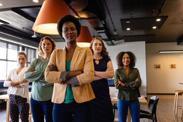Portrait of diverse female colleagues in casual meeting in office