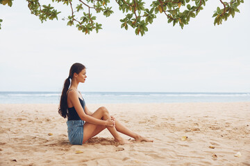 Fototapeta na wymiar sitting woman body travel freedom smile sea sand vacation beach nature