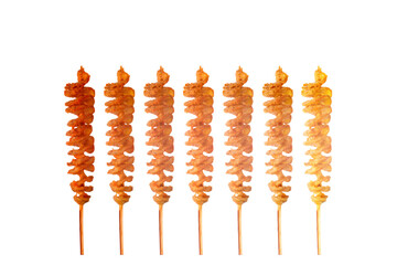 FriedTwist potato on bamboo skewers isolated on white background.