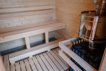 Fototapeta na wymiar inside the sauna of gray granite stones in oven