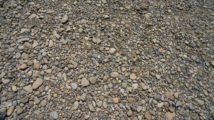 pebbles on the beach for background in format 16x9