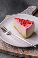 Delicious sweet dessert cheesecake with raspberry and pistachio flavor