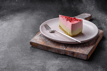 Delicious sweet dessert cheesecake with raspberry and pistachio flavor