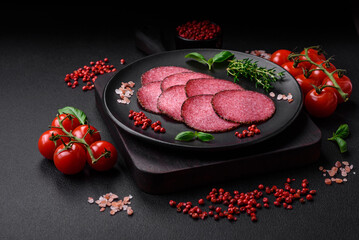 Delicious smoked salami sausage with salt, pepper, spices and herbs