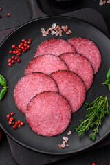 Delicious smoked salami sausage with salt, pepper, spices and herbs