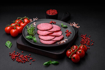 Delicious smoked salami sausage with salt, pepper, spices and herbs