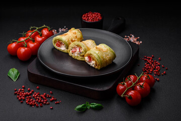 Delicious healthy vegetarian vegetable roll of zucchini, tomatoes, peppers and sauce