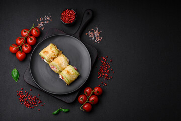 Delicious healthy vegetarian vegetable roll of zucchini, tomatoes, peppers and sauce