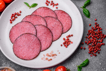 Delicious smoked salami sausage with salt, pepper, spices and herbs