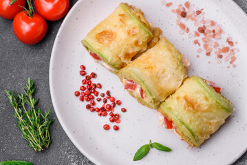 Delicious healthy vegetarian vegetable roll of zucchini, tomatoes, peppers and sauce