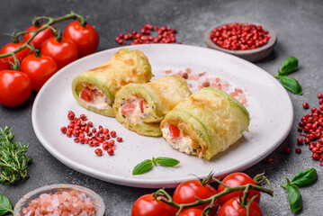 Delicious healthy vegetarian vegetable roll of zucchini, tomatoes, peppers and sauce