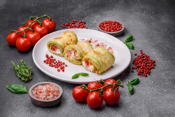 Delicious healthy vegetarian vegetable roll of zucchini, tomatoes, peppers and sauce