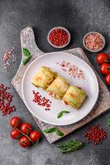 Delicious healthy vegetarian vegetable roll of zucchini, tomatoes, peppers and sauce