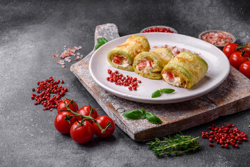 Delicious healthy vegetarian vegetable roll of zucchini, tomatoes, peppers and sauce