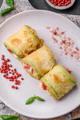 Delicious healthy vegetarian vegetable roll of zucchini, tomatoes, peppers and sauce