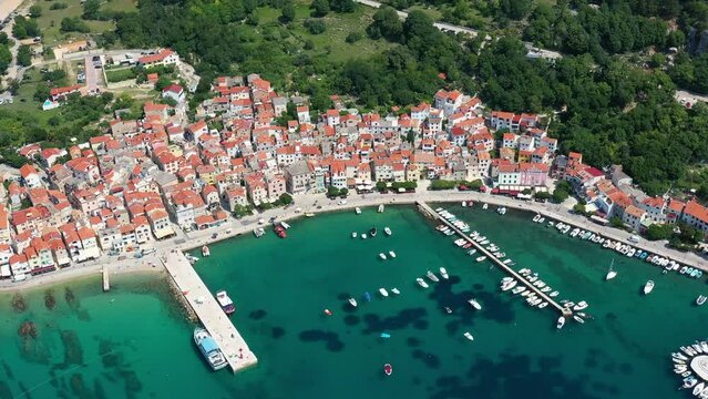 Krk island, Croatia: Aerial drone footage of the Baska vacations town in the Krk island in the Adriatic sea in northern Croatia. 
