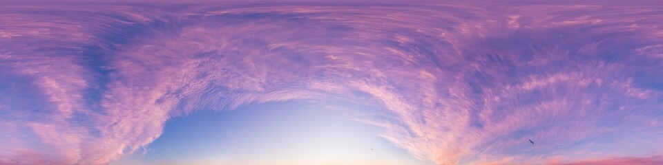 Sunset sky panorama with dramatic bright glowing pink Cirrus clouds. HDR 360 seamless spherical panorama. Full zenith or sky dome for 3D visualization, sky replacement for aerial drone panoramas.