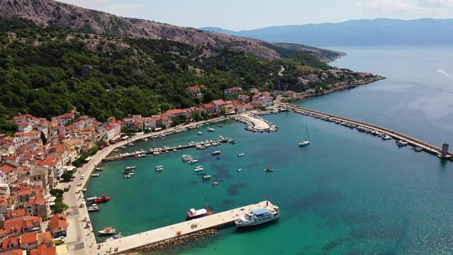 Krk island, Croatia: Aerial drone footage of the Baska vacations town in the Krk island in the Adriatic sea in northern Croatia. 