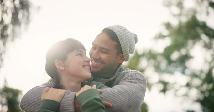 Smile, hug and couple outdoor, love and happiness with support, quality time and romantic gesture. Date, man and woman in a park, relationship or marriage with romance, embrace and happiness with joy