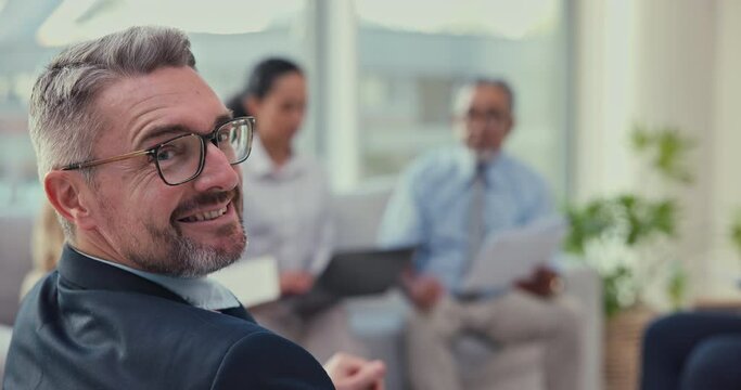 Meeting, discussion and face of a senior businessman in office boardroom for planning. Brainstorming, collaboration and portrait of mature male CEO working on project with colleagues in workplace