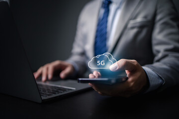 Businessman with 5g technology hologram, 5g networking, data forwarding and internet use efficiency and sensitivity of data forwarding through wireless network.
