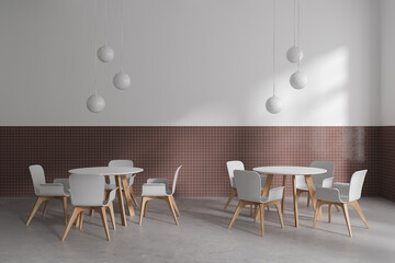 Stylish cafe interior with chairs and round table, eating space with furniture