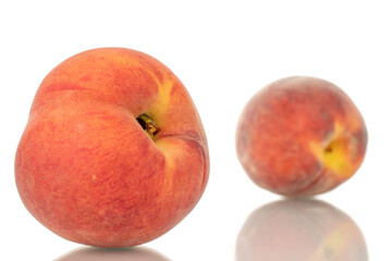 Two ripe organic peaches, macro, isolated on white background.