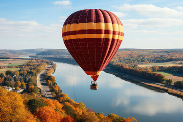 A hot air balloon soaring over a picturesque vineyard during harvest season, with grape clusters hanging from the vines, winemakers at work, and a warm autumn color palette