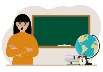 Female teacher near the blackboard. The concept of education, teaching, teacher's day.