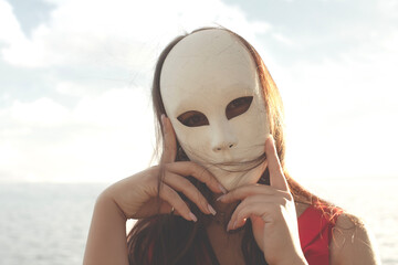 surreal portrait of a woman with mask, abstract concept