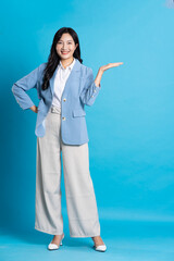 Asian young businesswoman portrait on blue background