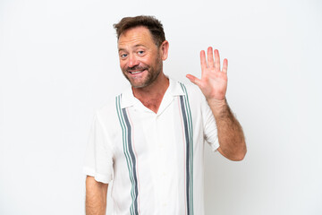 Middle age caucasian man isolated on white background saluting with hand with happy expression