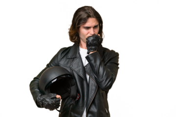 Young handsome man with a motorcycle helmet isolated on green chroma background having doubts