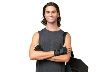 Young sport handsome man isolated on green chroma background keeping the arms crossed in frontal...