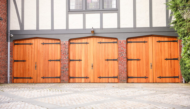 garage door stands as a gateway of privacy and utility, symbolizing security, shelter, and the hidden narratives within a home