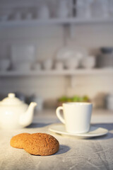 Lunch with cookies and coffee on the table. Teapot with tea
