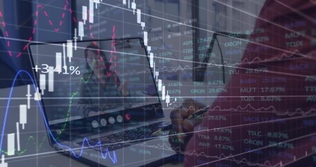 Animation of stock market data processing over african american man having a videocall on laptop - Powered by Adobe