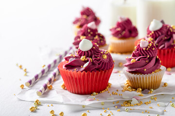 Tasty and sweet red cupcakes made of whipped cream.
