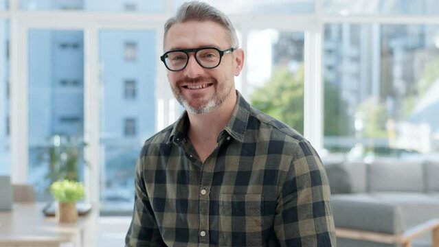 Face, happy man and senior designer in office, startup company or workplace. Portrait, glasses and smile of creative professional entrepreneur, boss and manager from Australia with career in business