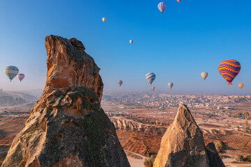 Goreme big stone, hot air balloons fly in sky Cappadocia National Park summer, Turkey Travel