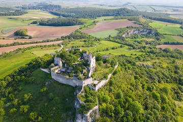 Falkenstein castle seen from the air surrounded by trees, fields and vineyards, located in Weinviertel region in Austria