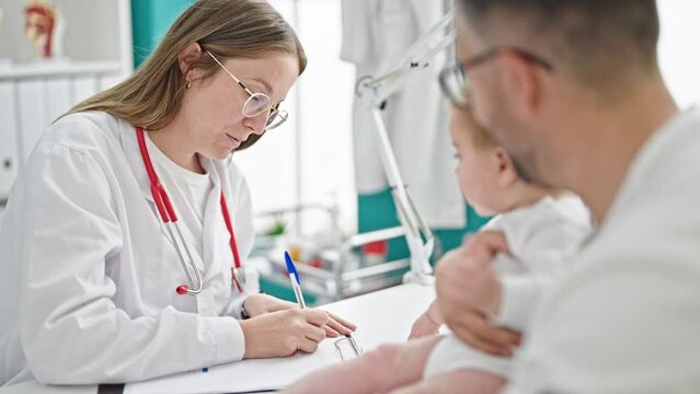 Hispanic father with baby on a doctor appointment at clinic