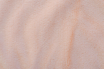 texture of a soft pink plaid with pile, close-up