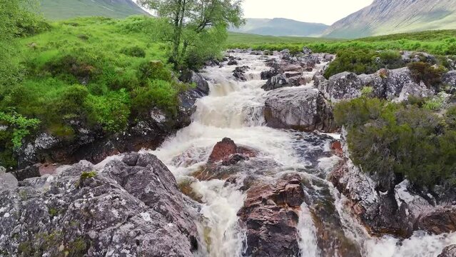 Buachaille Etive M&ograve;r and Waterfall from a drone, River Coupall, Glen Etive and River Etive, Highlands, Scotland, UK