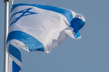 Israeli flag for advertising, celebration, achievements, festivals, elections. The flag of Uzbekistan flutters in the beautiful sky. Great for news.