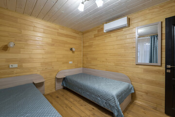 Naklejka premium interior of wooden eco bedroom in studio apartments, hostel or homestead